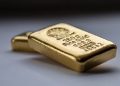 Gold Drops 0.2% to $2,415.61 Amid Strong Dollar
