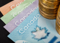 USD/CAD Dips to 1.3710; Key Indicators and Fed Comments