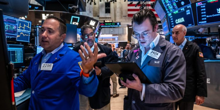 Dow rises 200 points to close at a record