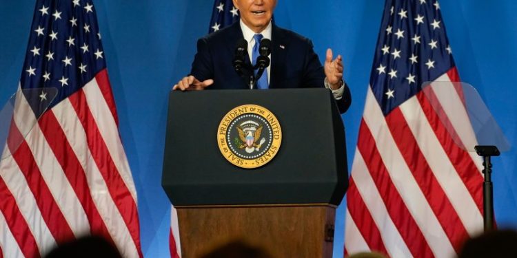 Biden faces more calls to withdraw as he visits Michigan to rally support