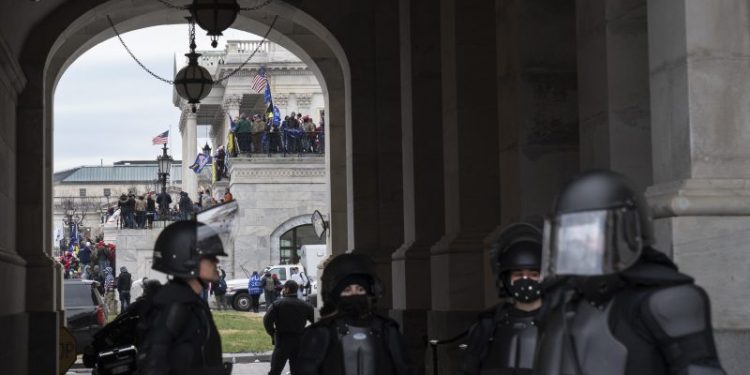 He joined the force after allegedly storming the Capitol. He was just arrested.