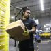 Amazon increases average pay for warehouse workers and adds free Prime membership perk