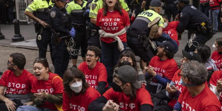 Protesters stage sit-in outside New York Stock Exchange to spotlight Gaza attacks